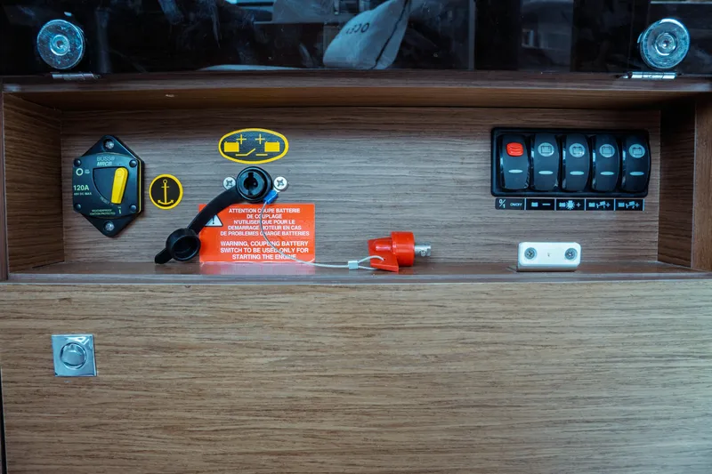 Slide: The Image of Control panel of 2023 Jeanneau NC 1095 boat with switches and battery indicators. - 42
