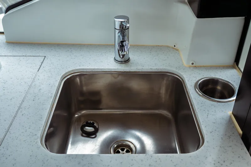 Slide: The Image of Stainless steel sink in 2023 Jeanneau NC 1095 boat kitchen area. - 44