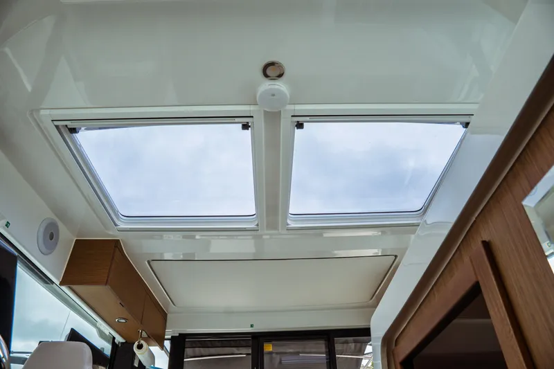 Slide: The Image of Interior view of 2023 Jeanneau NC 1095 boat with skylights and modern design. - 54