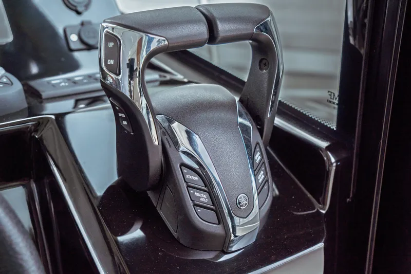 Slide: The Image of Throttle control of 2023 Jeanneau NC 1095 boat, featuring modern design and functionality. - 62