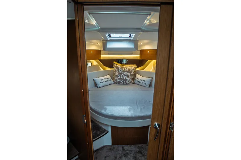 Slide: The Image of Luxurious cabin interior of 2023 Jeanneau NC 1095 boat with cozy bedding. - 70