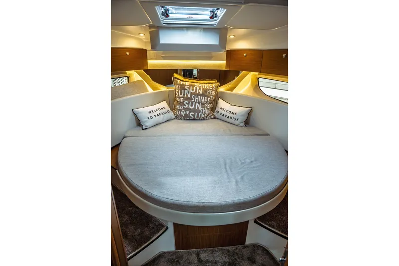 Slide: The Image of Luxurious cabin interior of 2023 Jeanneau NC 1095 with cozy bedding and decorative pillows. - 71
