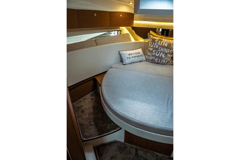 Slide: The Image of 2023 Jeanneau NC 1095 cabin interior with cozy bed and decorative pillows. - 74