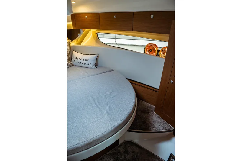 Slide: The Image of Luxurious cabin interior of 2023 Jeanneau NC 1095 with cozy bedding and elegant wood finish. - 75