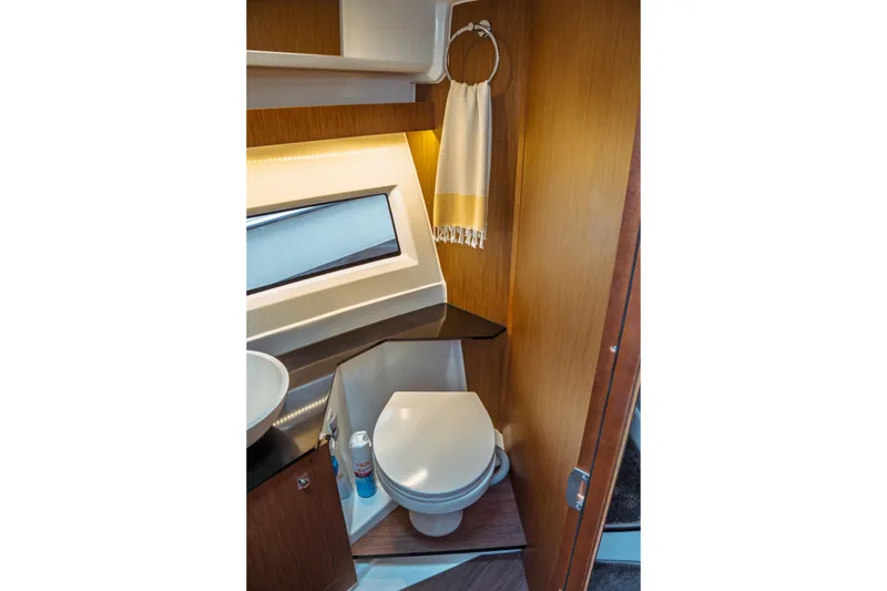 Slide: The Image of 2023 Jeanneau NC 1095 boat bathroom with modern fixtures and wooden accents. - 78
