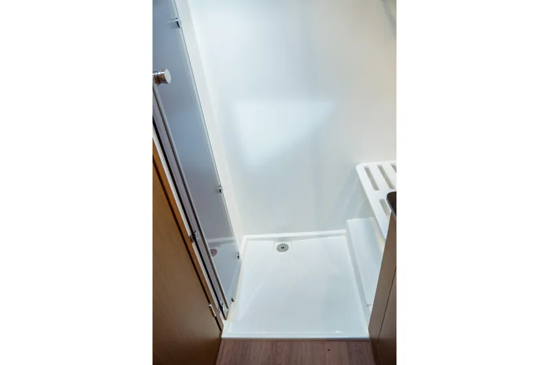 Slide: The Image of Shower area in 2023 Jeanneau NC 1095 boat, featuring sleek design and modern fixtures. - 81