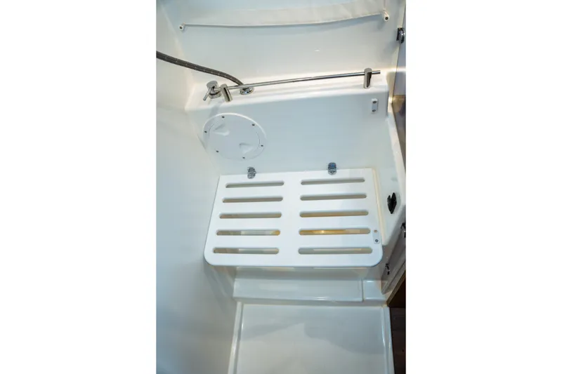 Slide: The Image of 2023 Jeanneau NC 1095 boat interior with white slatted platform and fixtures. - 83