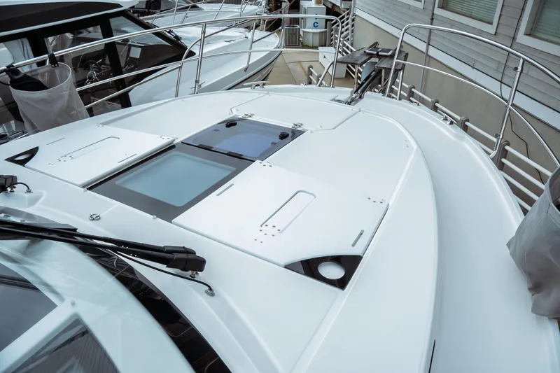 Slide: The Image of 2023 Jeanneau NC 1095 boat deck with sleek design and modern features. - 9