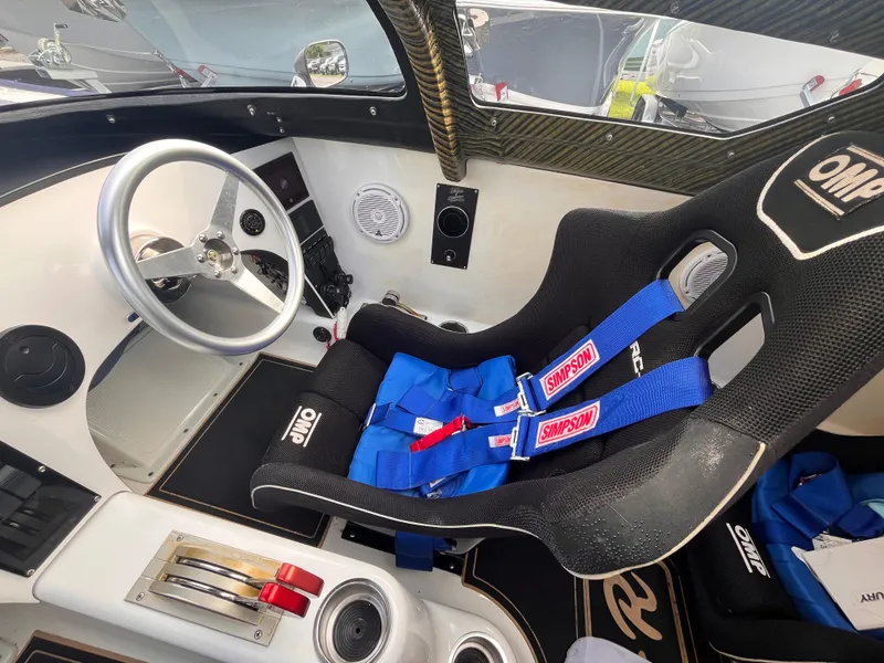 Slide: The Image of 2018 Lavey Craft 28 EVO cockpit with racing seat and steering wheel. - 11