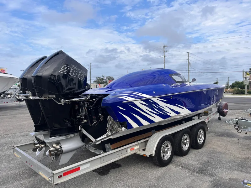 Slide: The Image of 2018 Lavey Craft 28 EVO boat on trailer with twin outboard engines. - 5