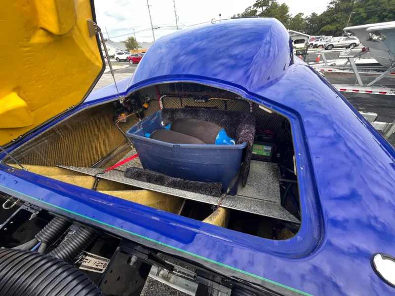 Slide: The Image of 2018 Lavey Craft 28 EVO engine compartment with open hatch, showcasing interior components. - 8