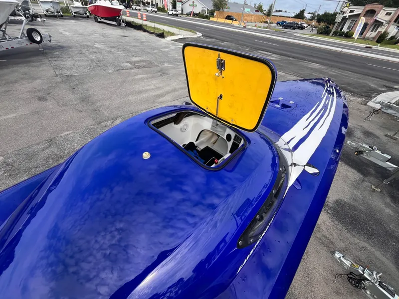 Slide: The Image of 2018 Lavey Craft 28 EVO boat with open hatch, vibrant blue exterior. - 9