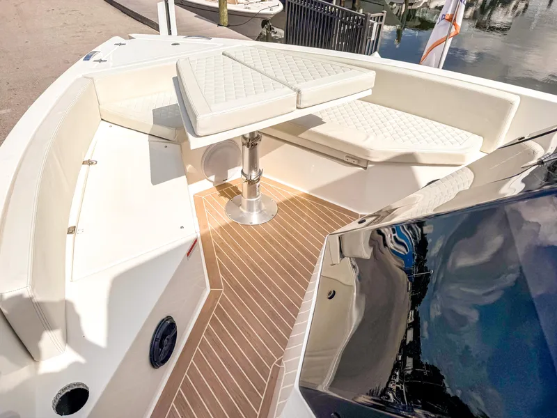 Slide: The Image of 2024 De Antonio Yachts D28 Open, featuring elegant seating and sleek deck design. - 14