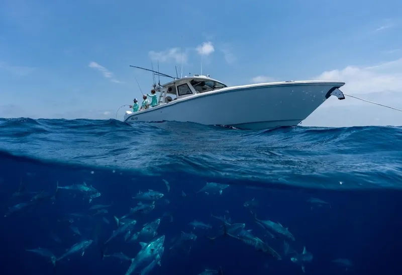 Slide: The Image of 2026 Solace 41 CS boat on ocean with fish swimming below. - 2