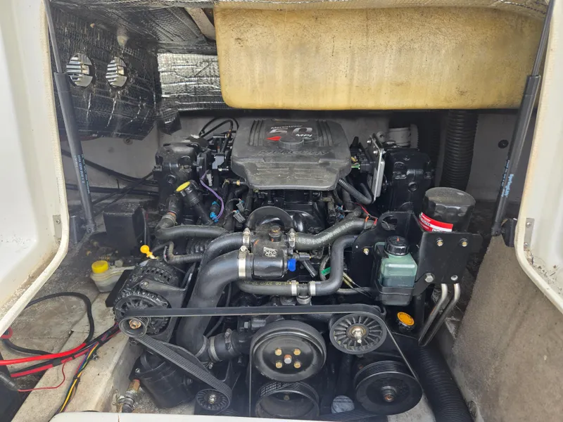 Slide: The Image of Engine compartment of a 2005 NauticStar 210 Sport Deck I/O boat, showcasing mechanical components. - 6