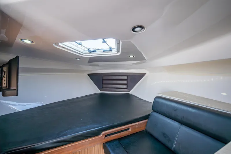 Slide: The Image of Interior cabin of 2014 Everglades 350LX boat with skylight and seating. - 7