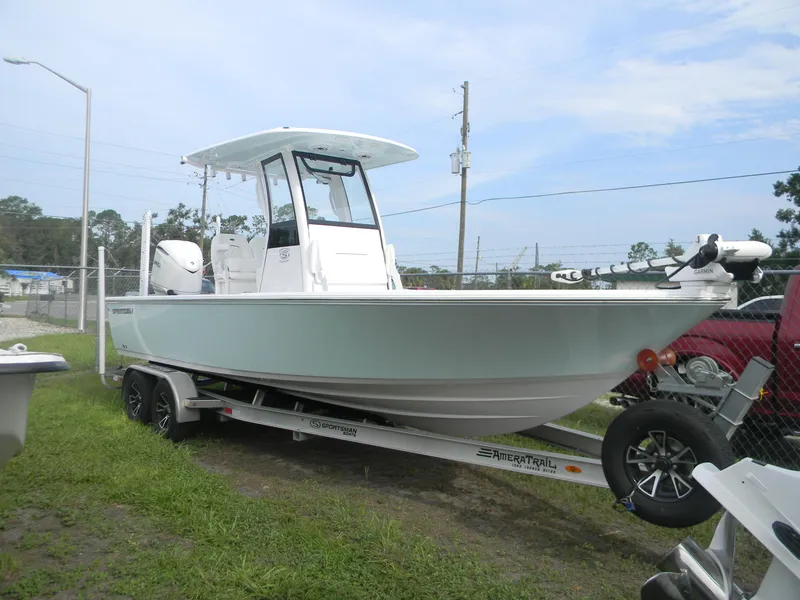 Slide: The Image of 2025 Sportsman Masters 247OE Bay Boat on trailer, parked outdoors. - 14