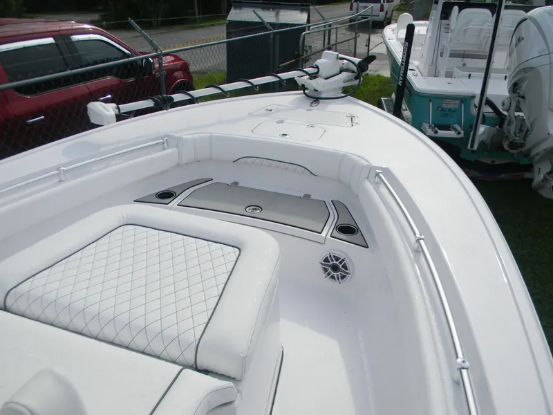 Slide: The Image of 2025 Sportsman Masters 247OE Bay Boat with white seating and advanced navigation equipment. - 17