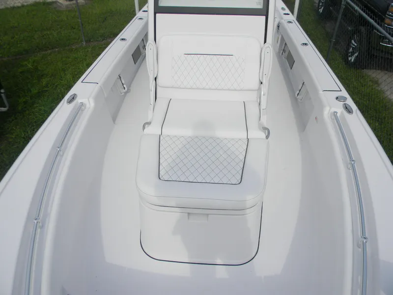 Slide: The Image of 2025 Sportsman Masters 247OE Bay Boat interior with cushioned seating and sleek design. - 18