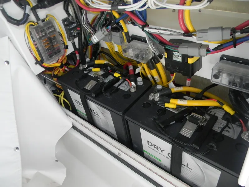 Slide: The Image of Electrical system of 2025 Sportsman Masters 247OE Bay Boat with batteries and wiring. - 26