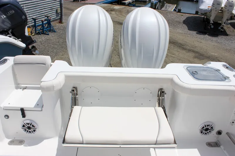 Slide: The Image of 2026 Sea Hunt Gamefish 27 boat with dual engines and forward seating. - 10