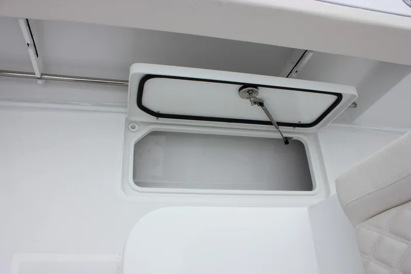 Slide: The Image of Open storage compartment on 2026 Sea Hunt Gamefish 27 Forward Seating boat. - 14