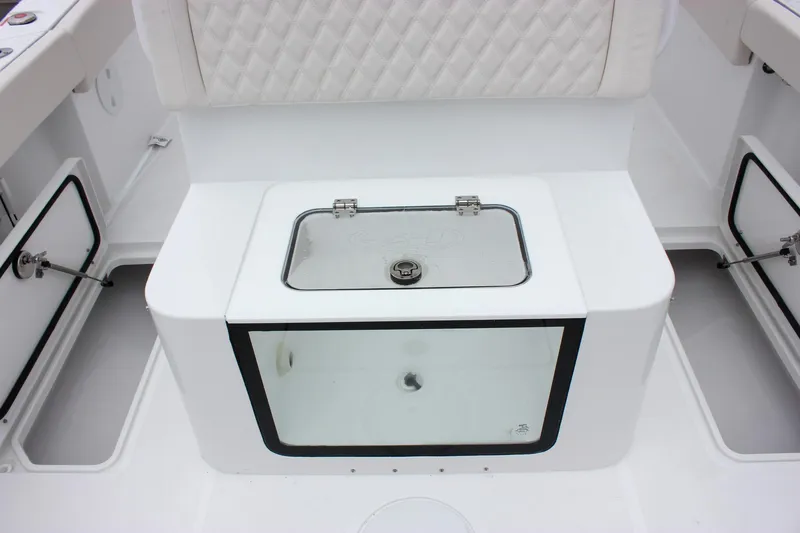 Slide: The Image of 2026 Sea Hunt Gamefish 27 Forward Seating livewell with transparent lid and white cushioned seating. - 15