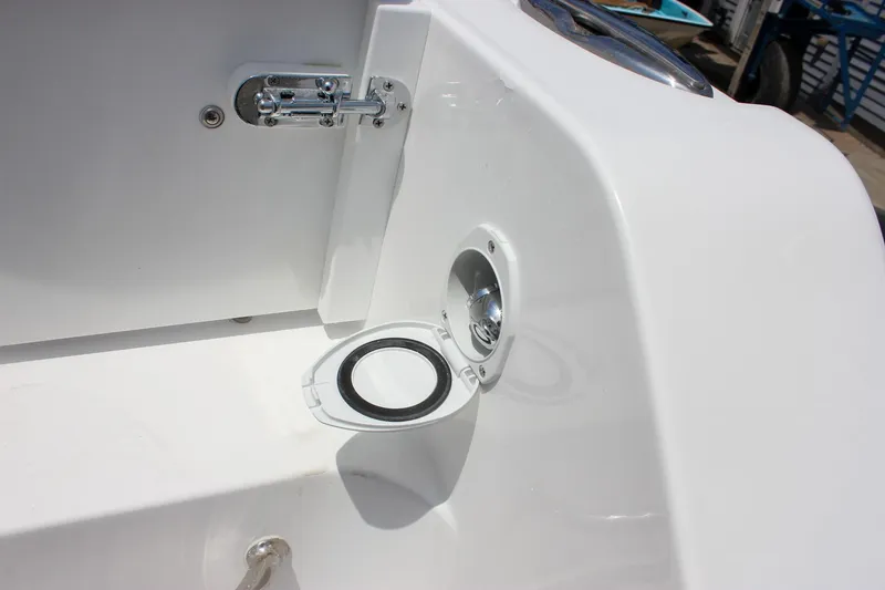 Slide: The Image of 2026 Sea Hunt Gamefish 27 boat detail showing a hatch and latch mechanism. - 17