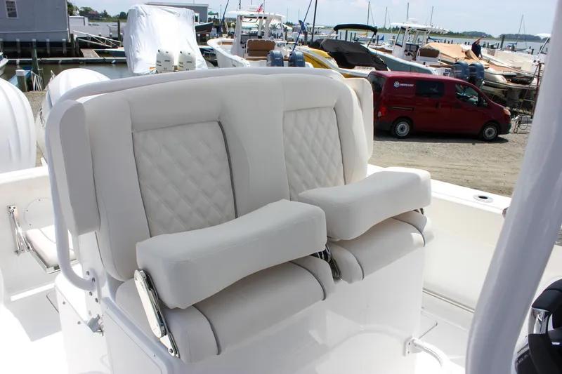 Slide: The Image of Luxurious seating on 2026 Sea Hunt Gamefish 27 boat, featuring plush white cushions. - 21