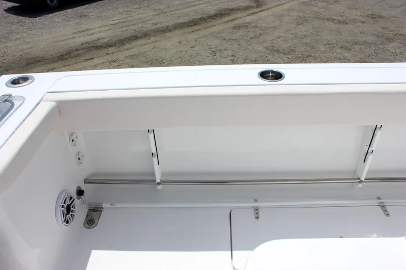 Slide: The Image of 2026 Sea Hunt Gamefish 27 Forward Seating interior with cup holder and speaker. - 26