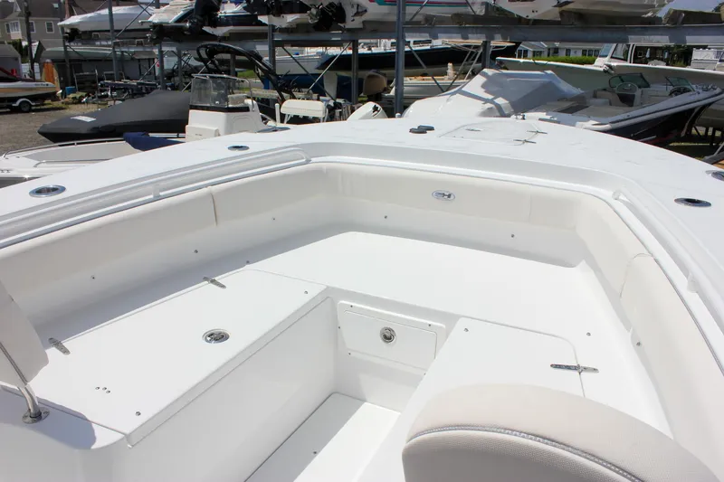 Slide: The Image of 2026 Sea Hunt Gamefish 27 Forward Seating boat interior, showcasing spacious white seating area. - 32