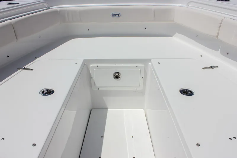 Slide: The Image of 2026 Sea Hunt Gamefish 27 Forward Seating, spacious deck with storage compartments. - 33