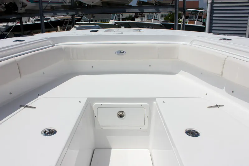 Slide: The Image of 2026 Sea Hunt Gamefish 27 Forward Seating, spacious white deck with storage compartments. - 34