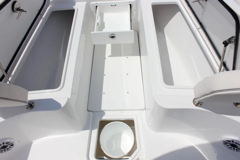 Slide: The Image of 2026 Sea Hunt Gamefish 27 Forward Seating interior with storage compartments and seating. - 36