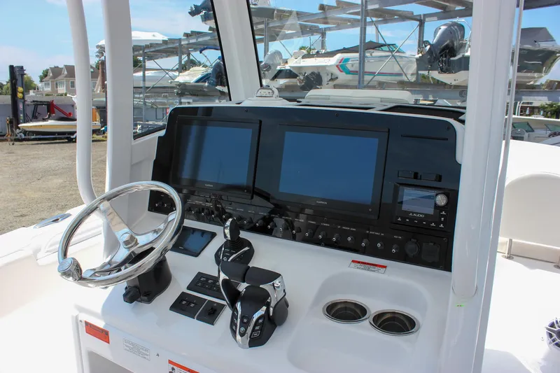 Slide: The Image of 2026 Sea Hunt Gamefish 27 dashboard with dual screens and modern controls. - 38
