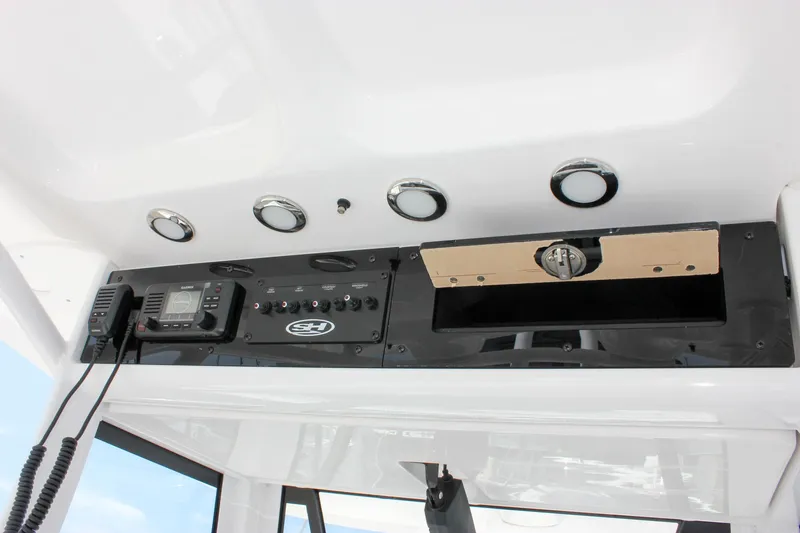 Slide: The Image of 2026 Sea Hunt Gamefish 27 console with radio and control panel. - 42