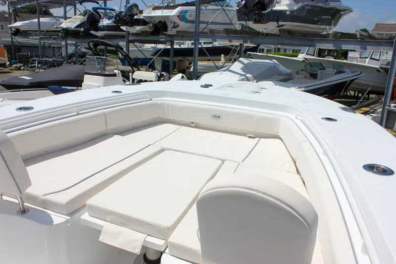 Slide: The Image of 2026 Sea Hunt Gamefish 27 Forward Seating boat with spacious white cushioned seating area. - 43