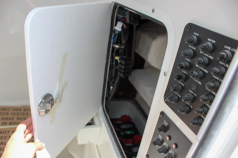 Slide: The Image of Electrical panel inside a 2026 Sea Hunt Gamefish 27 Forward Seating boat. - 51