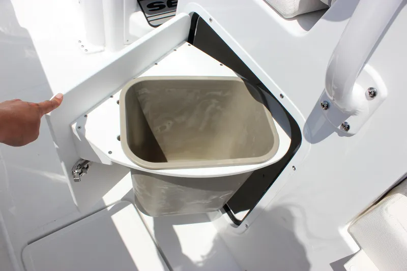 Slide: The Image of 2026 Sea Hunt Gamefish 27 Forward Seating storage compartment with open lid. - 53