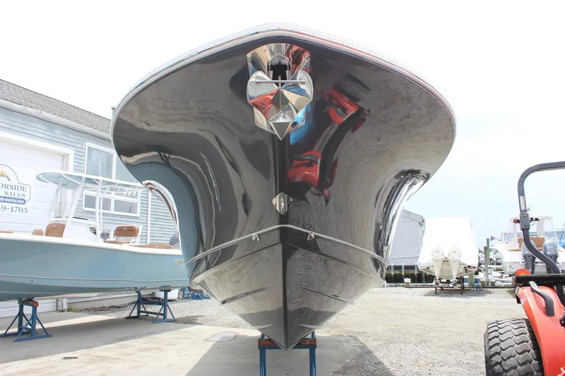 Slide: The Image of 2026 Sea Hunt Gamefish 27 Forward Seating boat on display at a marina. - 6