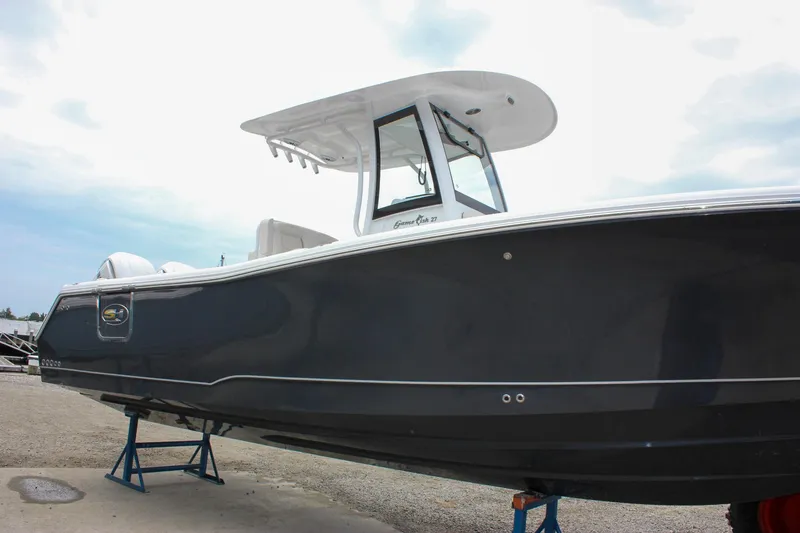 Slide: The Image of 2026 Sea Hunt Gamefish 27 Forward Seating boat on stands, side view. - 7