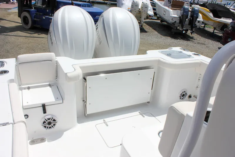 Slide: The Image of 2026 Sea Hunt Gamefish 27 boat with dual engines and spacious seating area. - 9