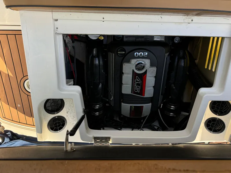 Slide: The Image of Engine compartment of a 2017 Sea Ray SPX 190 boat, showcasing the 4.5L engine. - 5