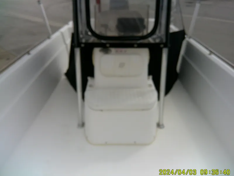 Slide: The Image of 2010 Carolina Skiff 238 DLV boat interior with seating and console. - 11