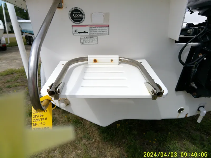Slide: The Image of 2010 Carolina Skiff 238 DLV boat ladder and handle detail. - 23
