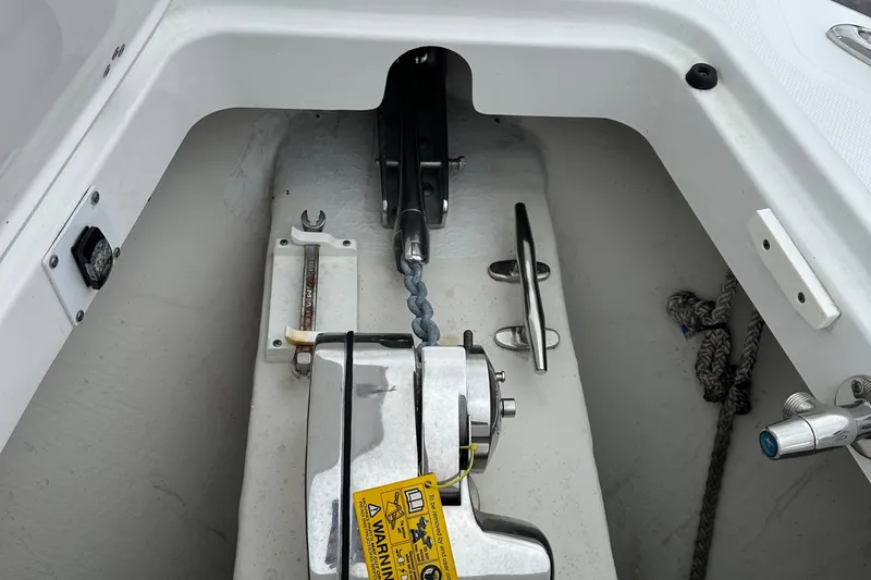 Slide: The Image of Anchor system of a 2020 Edgewater 370CC boat, featuring a winch and chain. - 15