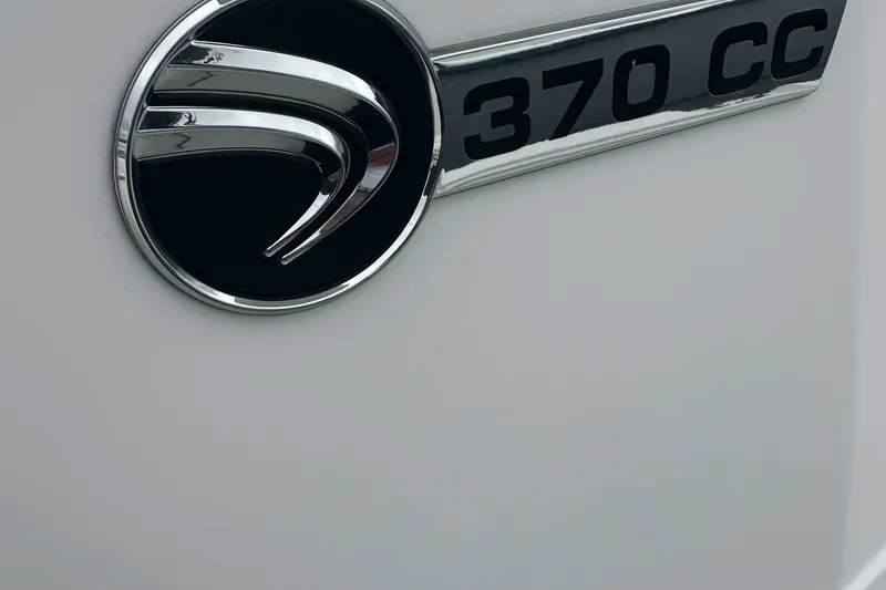 Slide: The Image of Edgewater 370CC 2020 model emblem on a sleek white surface. - 16