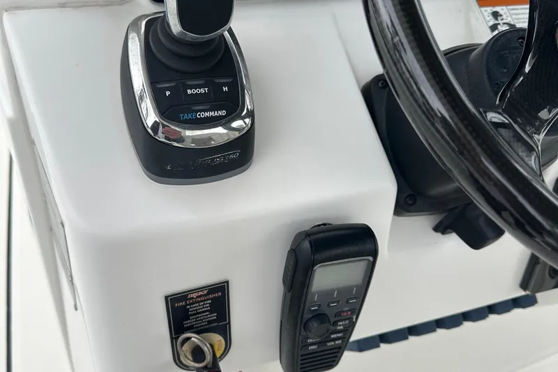 Slide: The Image of Edgewater 370CC 2020 boat control panel with joystick and steering wheel. - 3