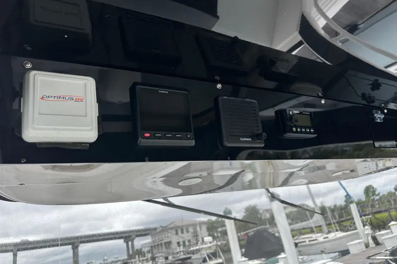 Slide: The Image of Edgewater 370CC 2020 boat dashboard with Garmin and Optimus EPS controls. - 4