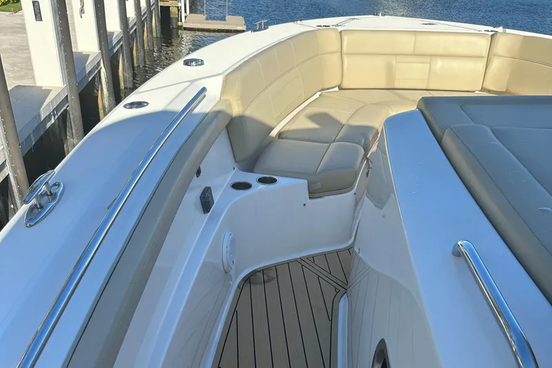 Slide: The Image of 2018 Pursuit 408S boat with beige seating and sleek design. - 17